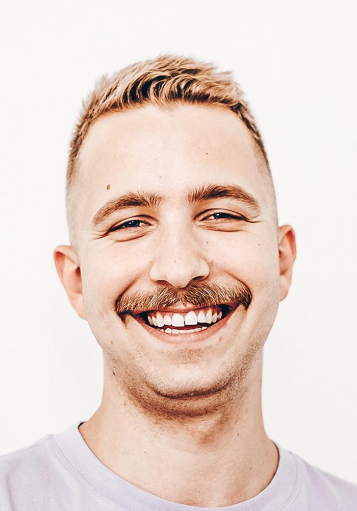 Headshot of account manager Andrew Kebalo smiling in a t-shirt